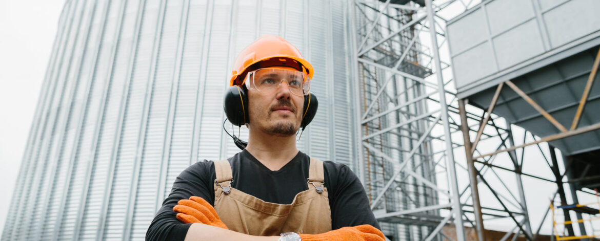 a-male-worker-in-front-of-grain-silos-2024-09-19-18-05-53-utc a-male-worker-in-front-of-grain-silos-2024-09-19-18-05-53-utc